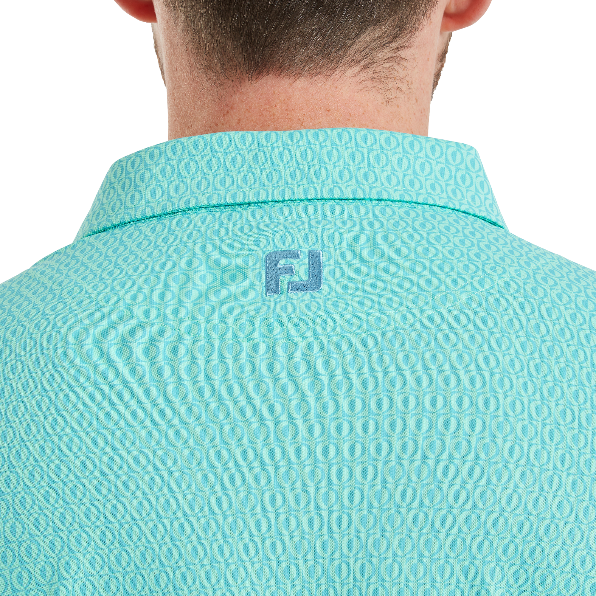 Polo piqu&eacute; &agrave; motifs g&eacute;om&eacute;triques modernistes