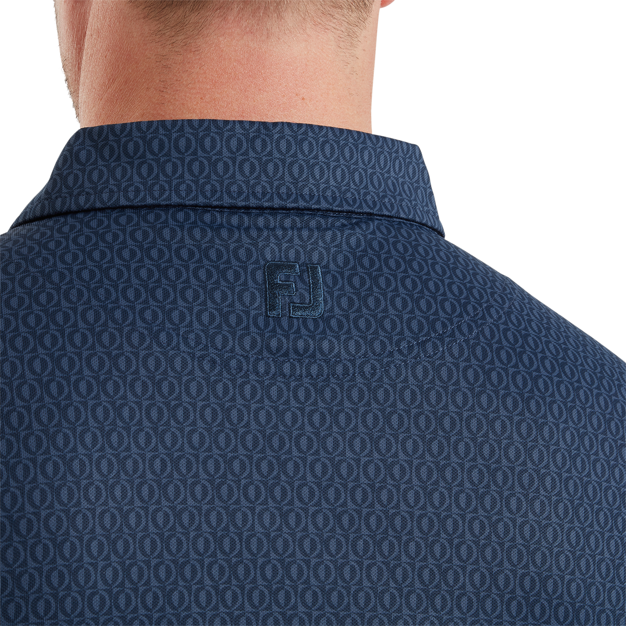 Polo piqu&eacute; &agrave; motifs g&eacute;om&eacute;triques modernistes