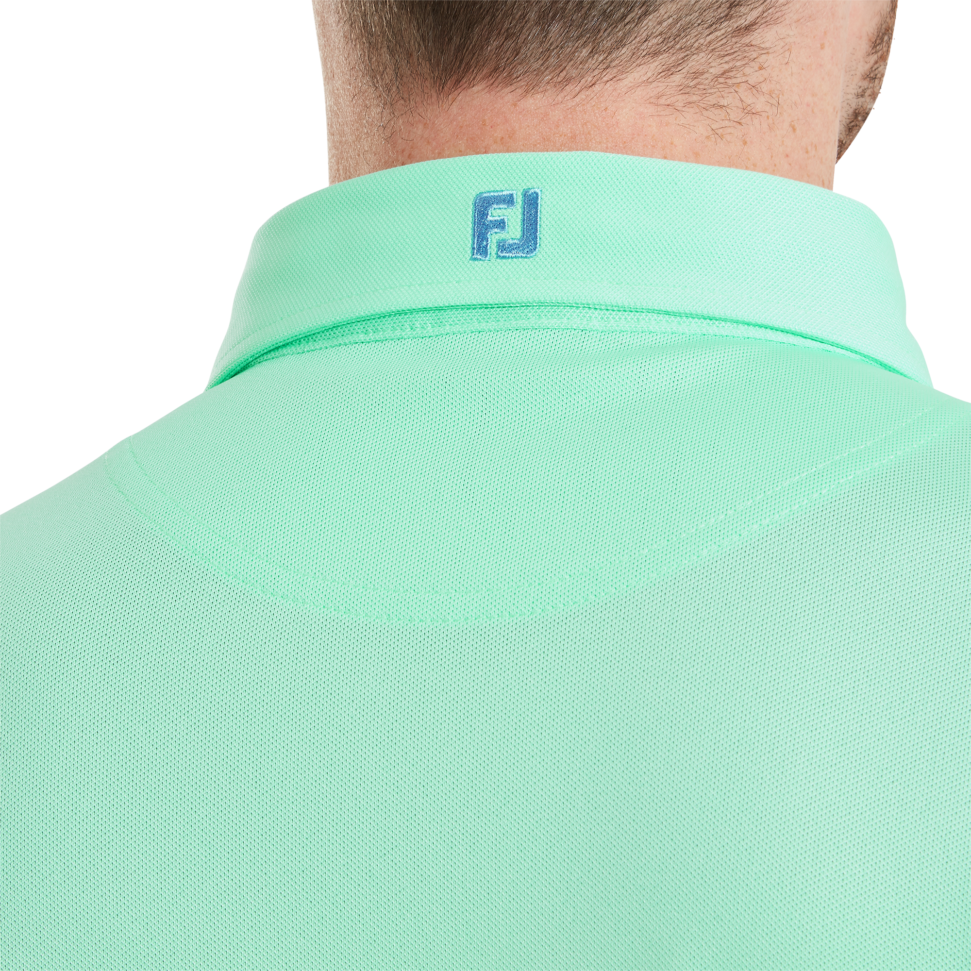 Polo Stretch Piqu&eacute; uni avec logo FJ sur col